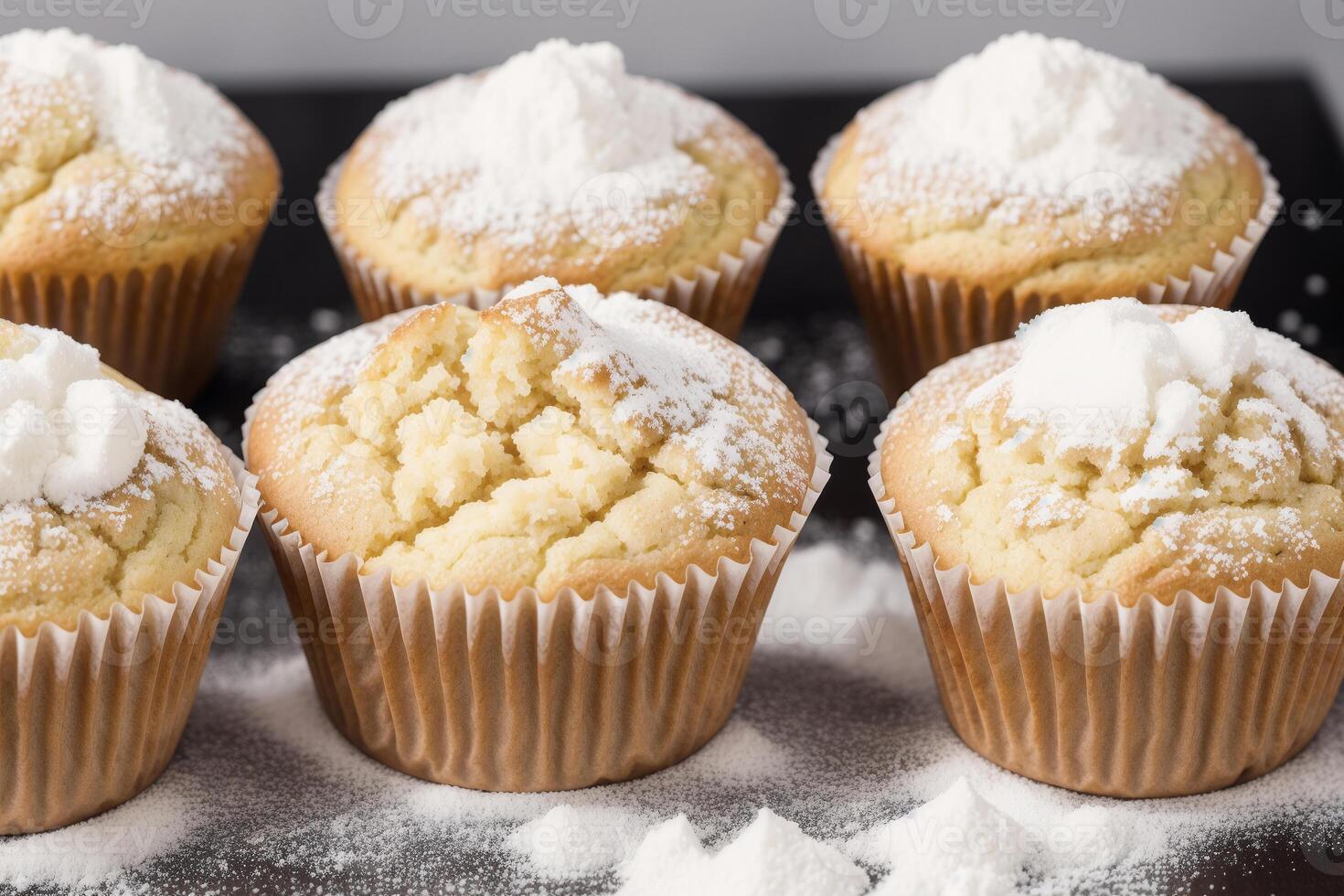 Homemade muffins with cinnamon and almonds on a black background. photo