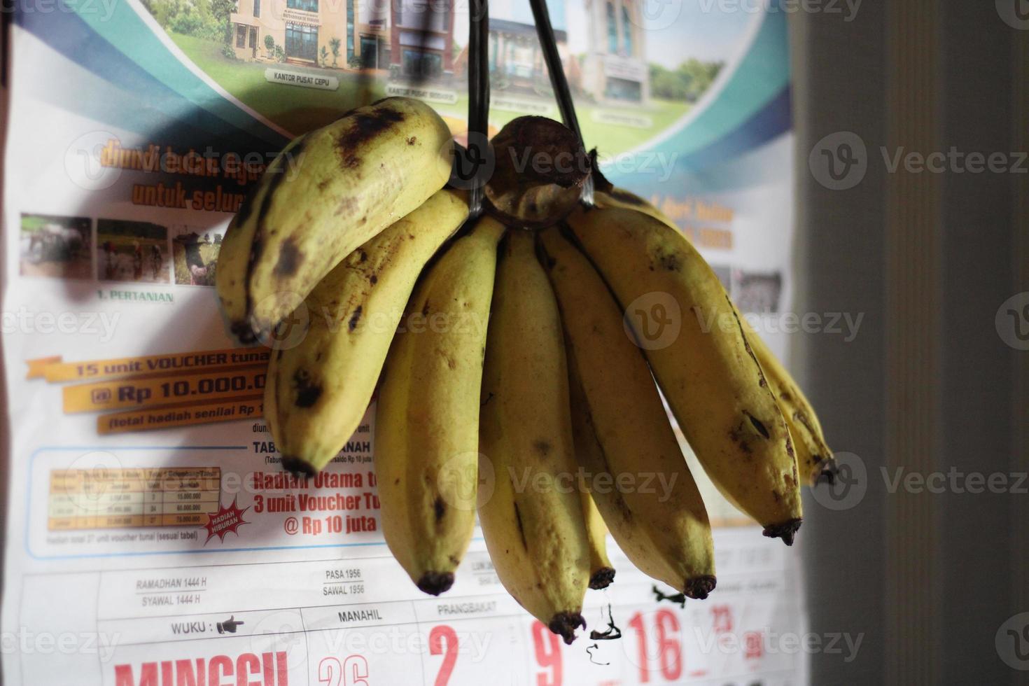 Photos of bananas hanging on the wall 22948748 Stock Photo at Vecteezy