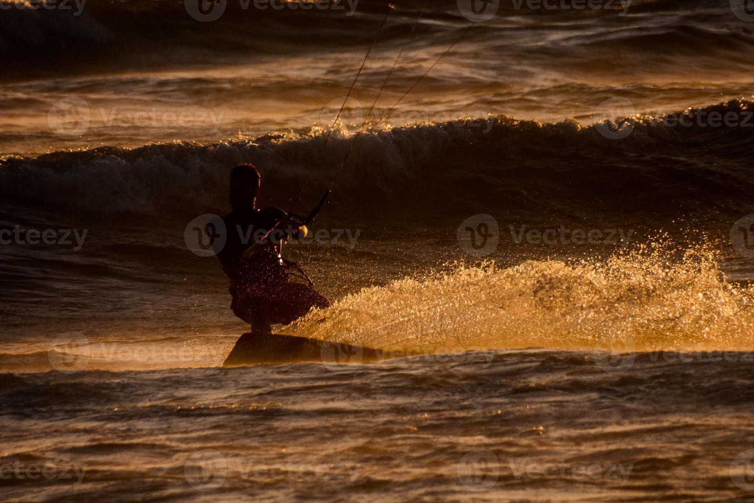 Kitesurfer at sunset photo