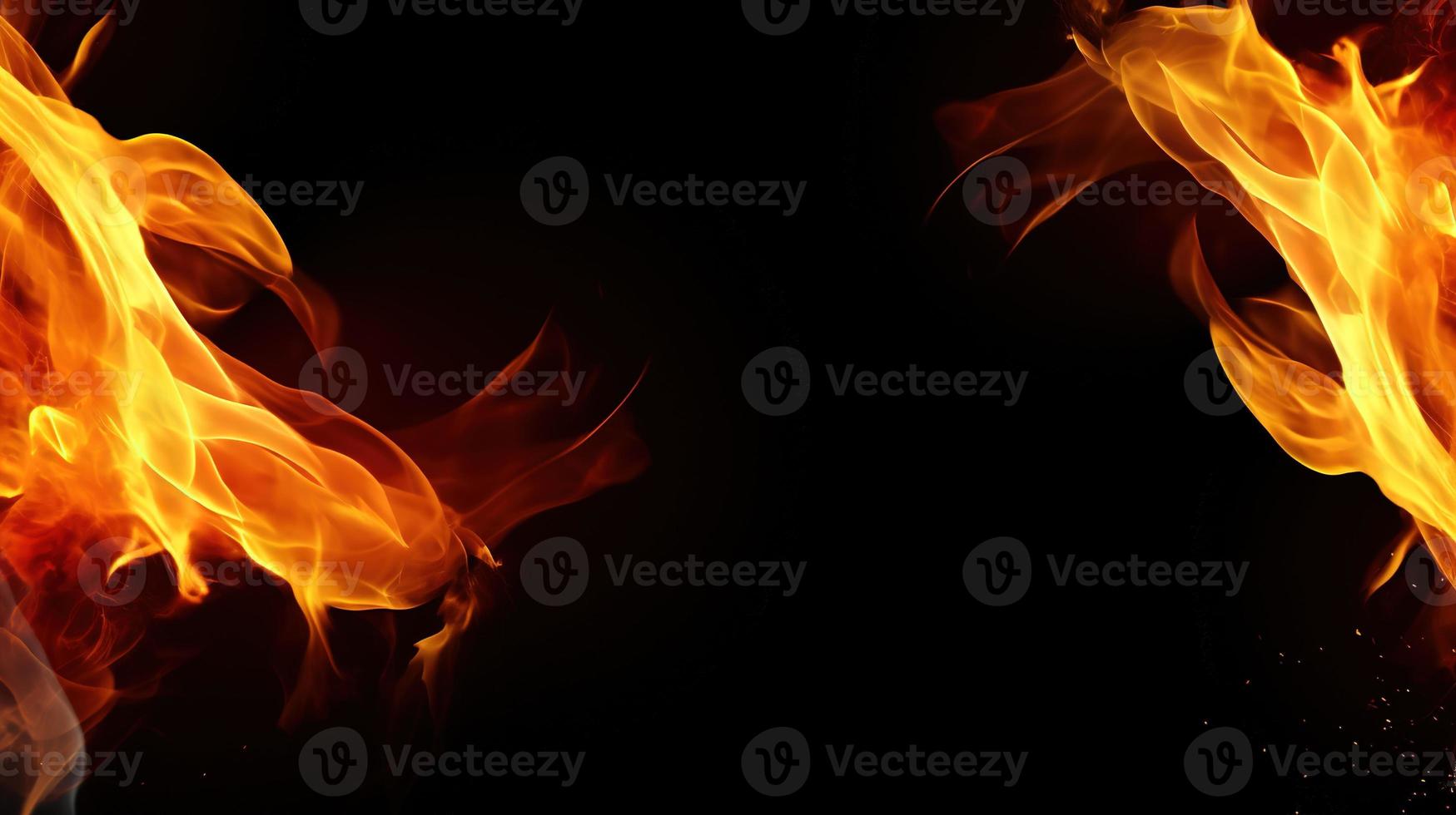 Fire flames on black background. Closeup of fire flames isolated on black background. photo
