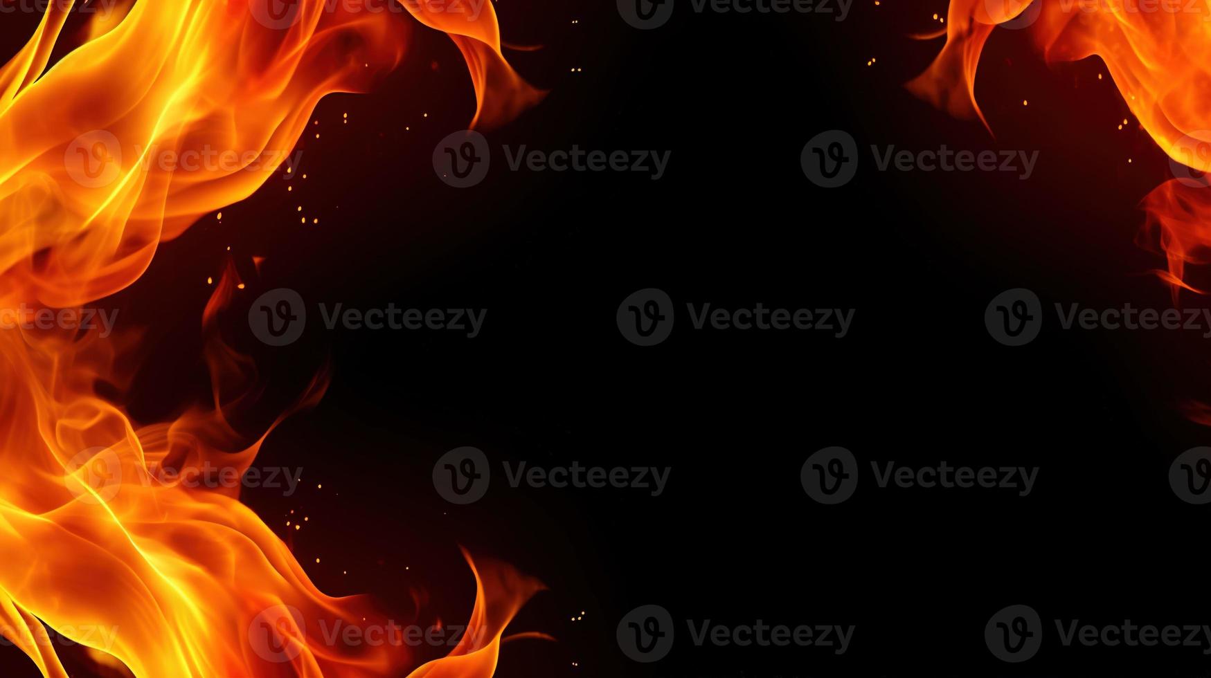 Fire flames on black background. Closeup of fire flames isolated on black background. photo