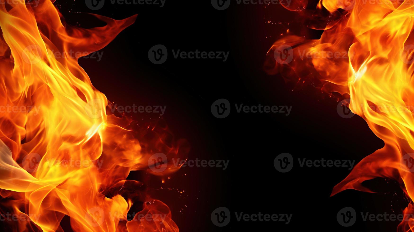 Fire flames on black background. Closeup of fire flames isolated on black background. photo