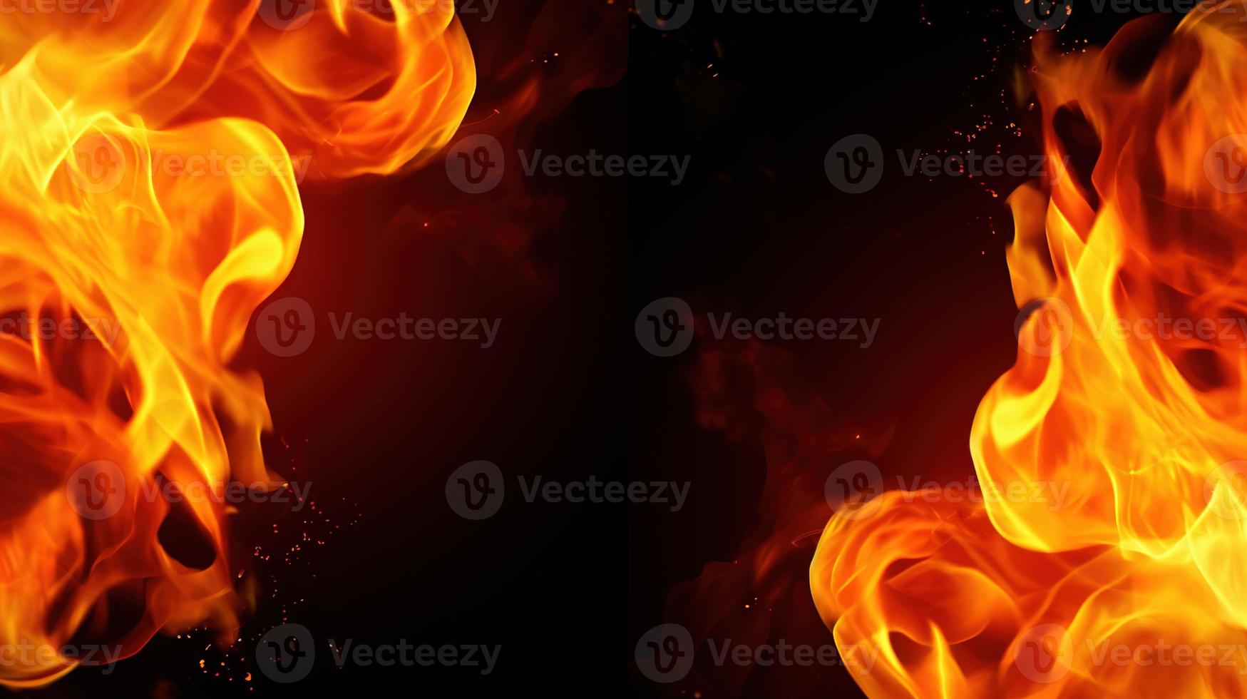 Fire flames on black background. Closeup of fire flames isolated on black background. photo