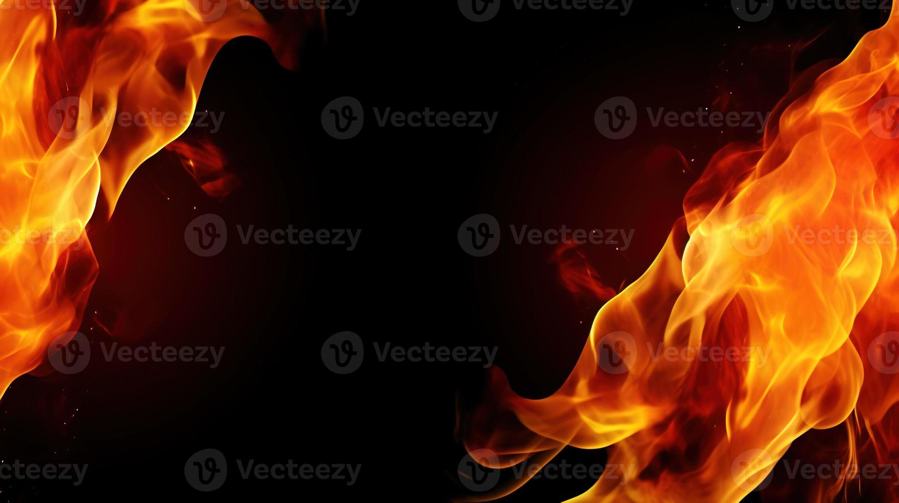 Fire flames on black background. Closeup of fire flames isolated on black background. photo