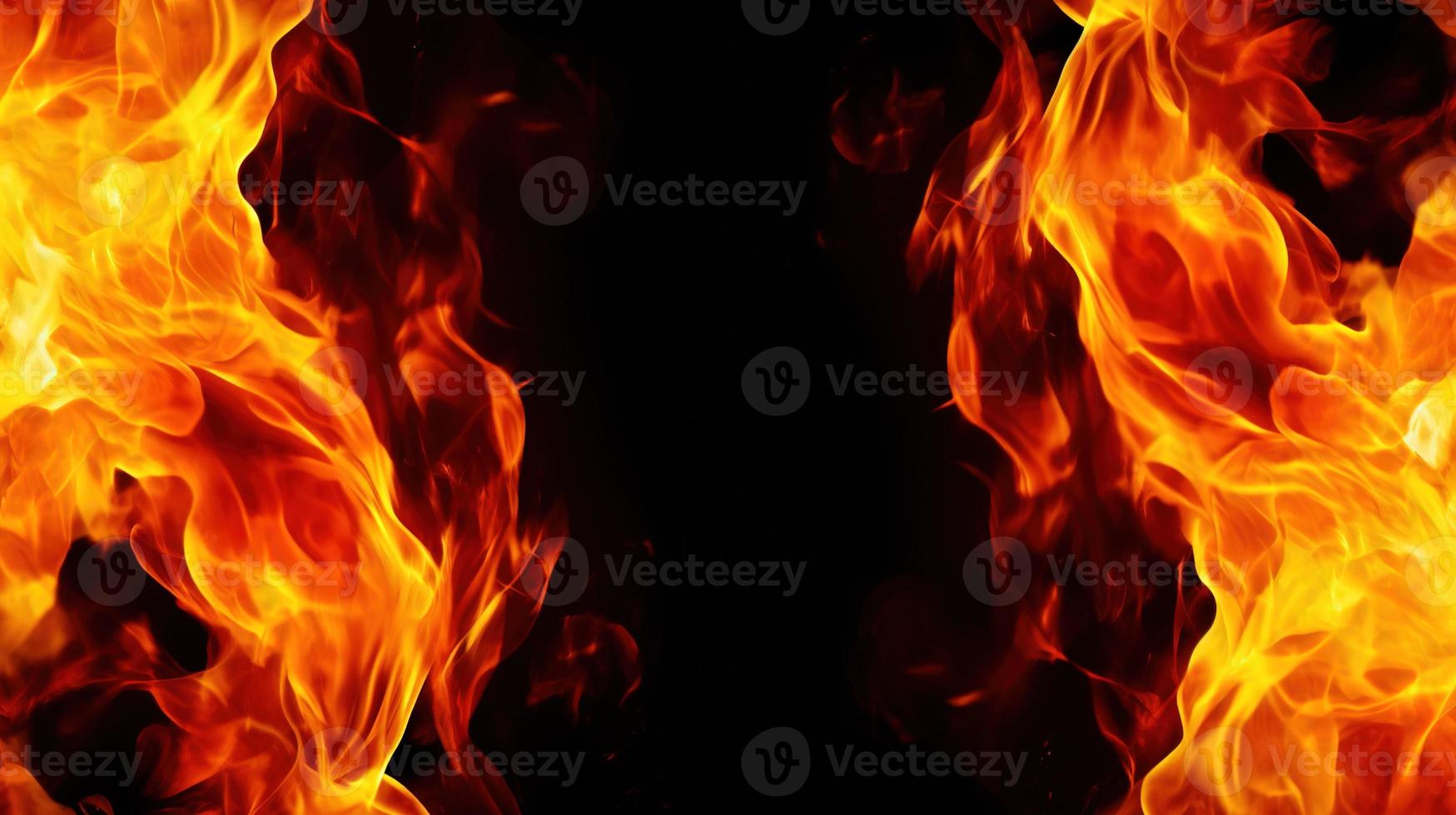 Fire flames on black background. Closeup of fire flames isolated on black background. photo