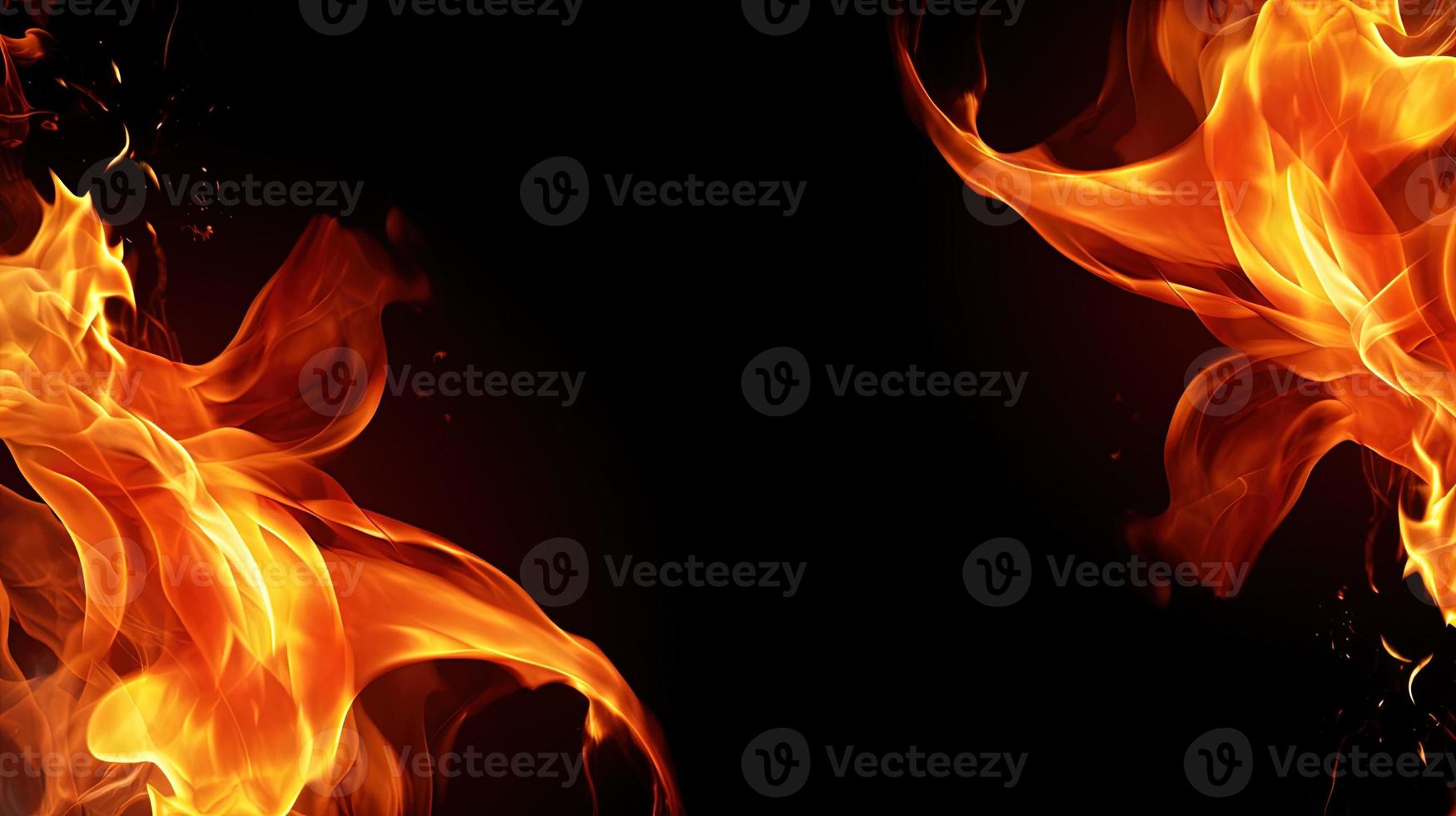 Fire flames on black background. Closeup of fire flames isolated on black background. photo