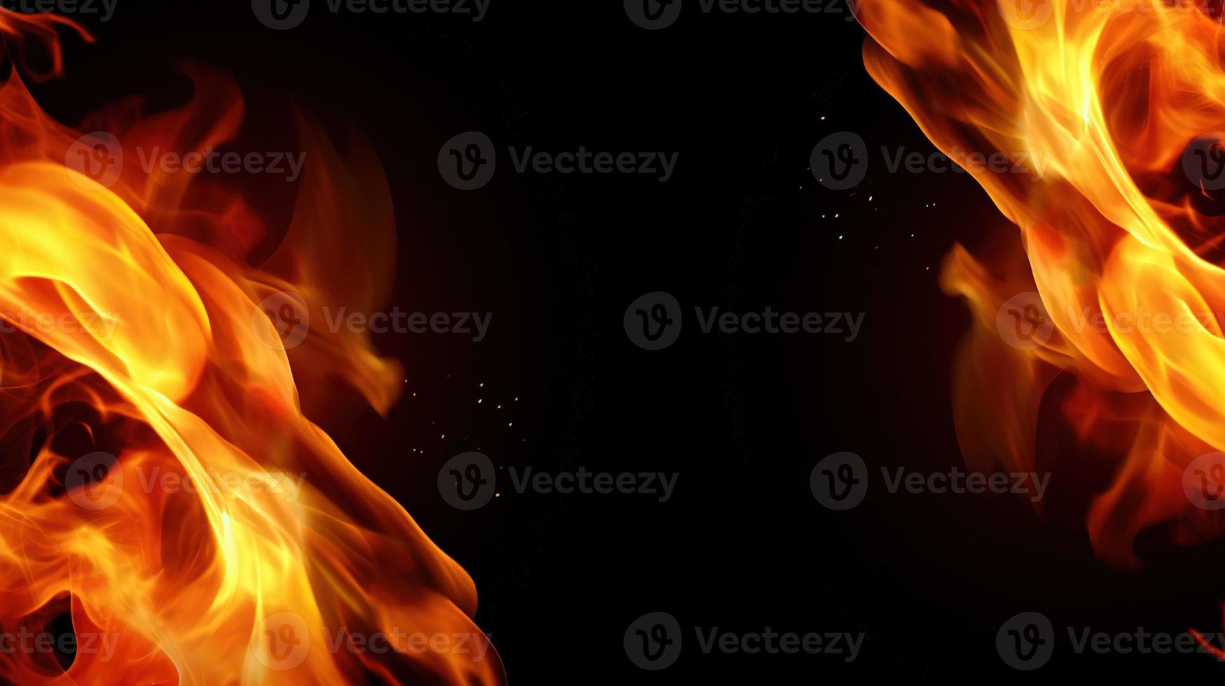 Fire flames on black background. Closeup of fire flames isolated on black background. photo