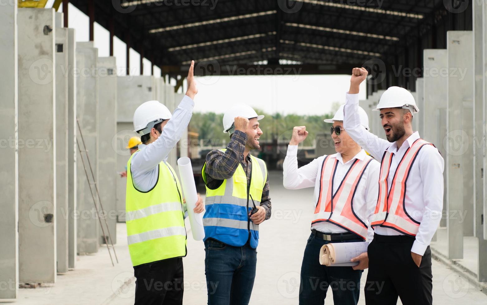 Construction engineers, architects, and foremen form a group. Participate in a meeting to plan new construction projects. Cheers to express happiness that the event was successfully accomplished. photo
