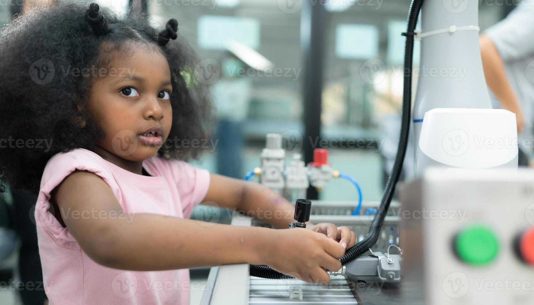 Youngsters utilizing the hand robot technology are having fun learning the electronic circuit board of hand robot technology, which is one of the STEM courses. photo