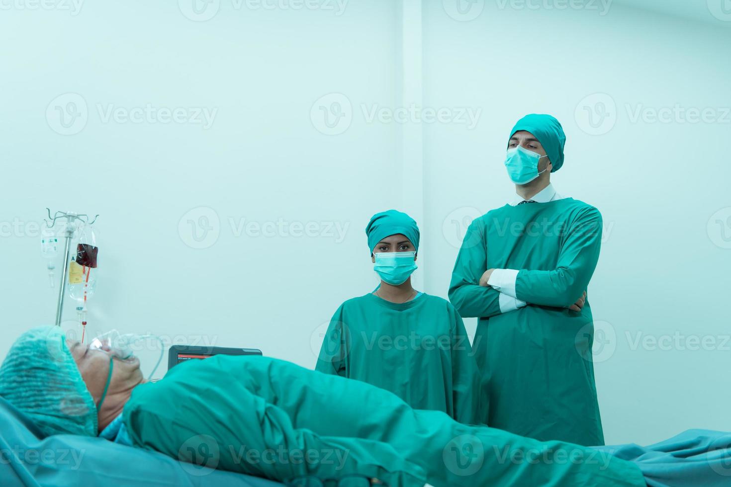 Portrait of professor of medicine in cardiology and a team of doctors in the operating room undergoing heart transplant surgery photo