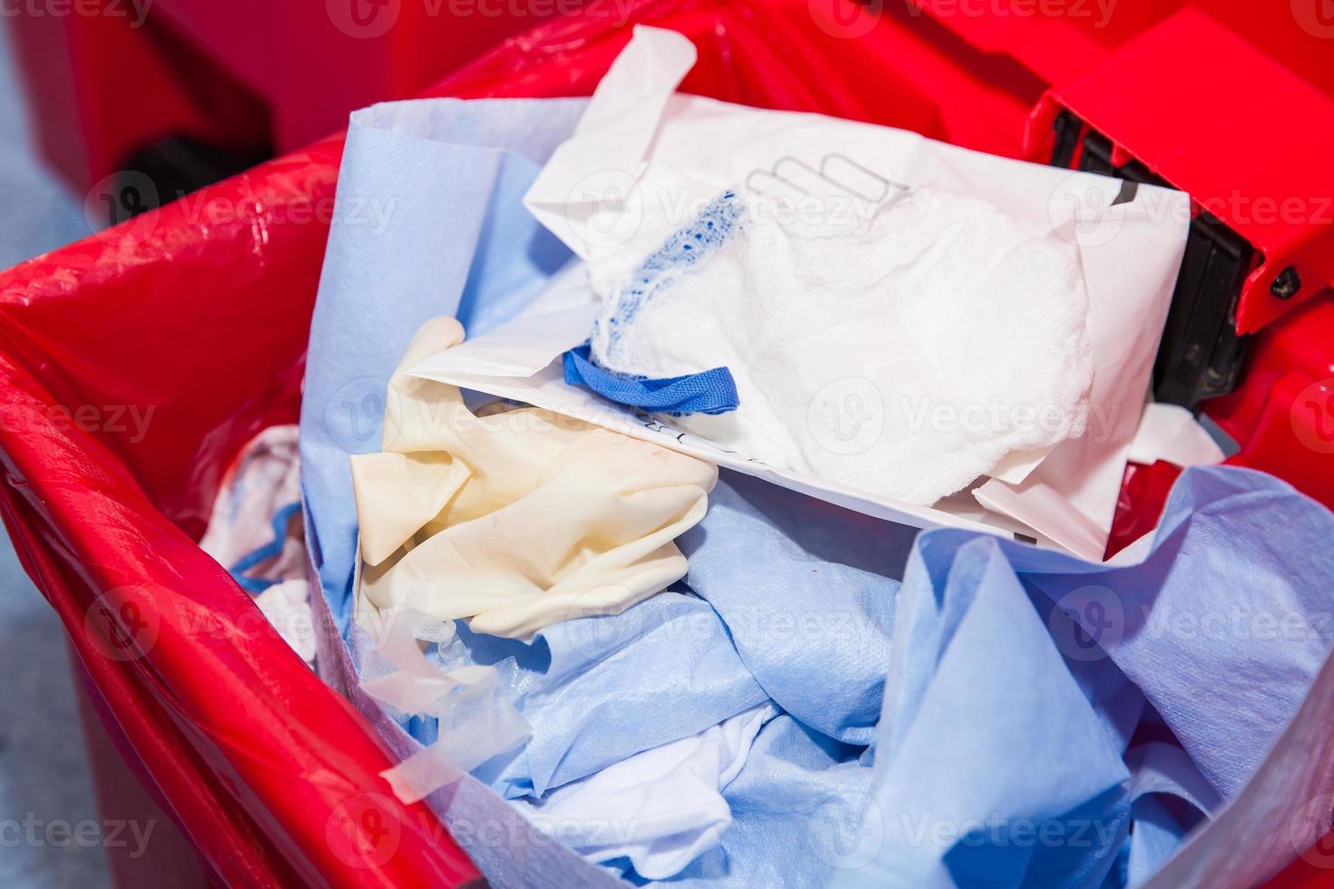 Biological risk waste disposed of in the red trash bag at a operating room in a hospital photo