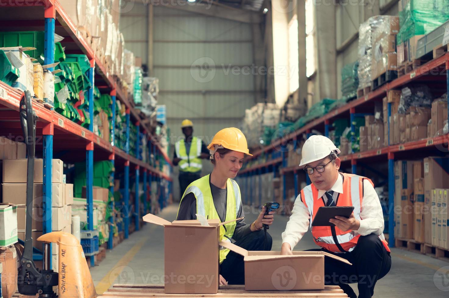 Before exporting to other nations, The product owner meets with the foreman and warehouse personnel to verify their own items held at this warehouse. photo