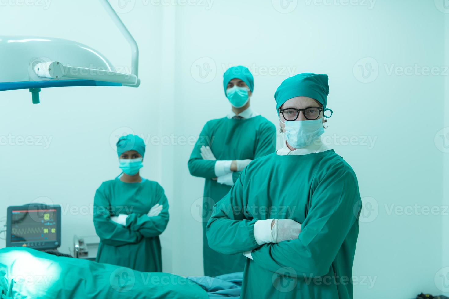 Portrait of professor of medicine in cardiology and a team of doctors in the operating room undergoing heart transplant surgery photo