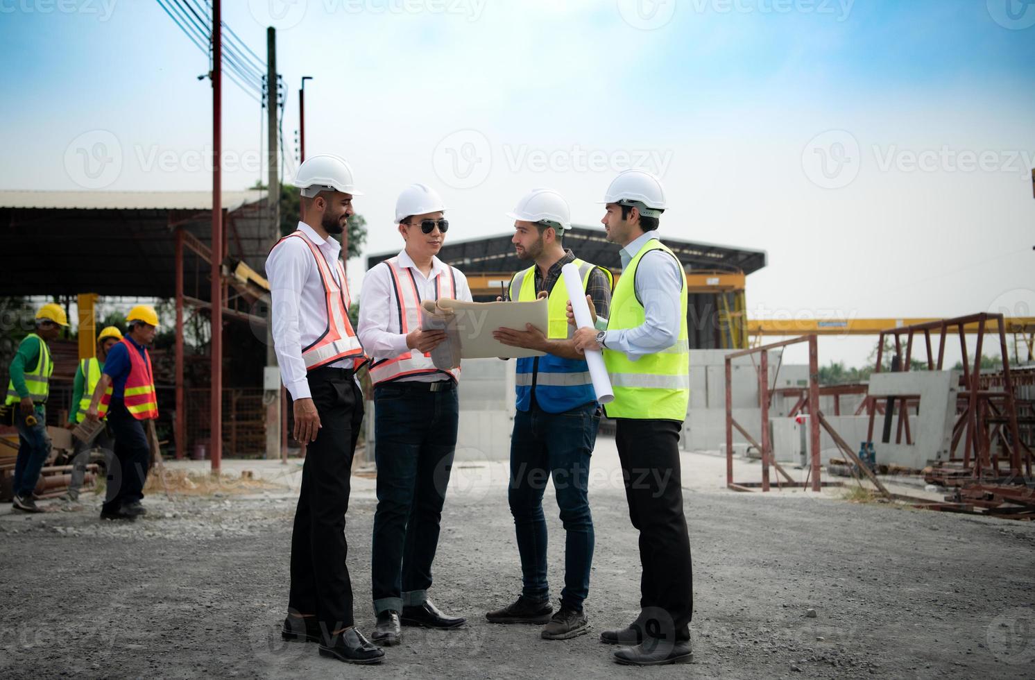 Architects a visit to the construction site. Ready to talk the progress of construction projects in the construction area with construction supervision engineers. photo