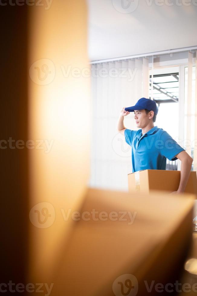 The delivery man brings the goods that the customer purchased and delivers them to the customer's home. photo