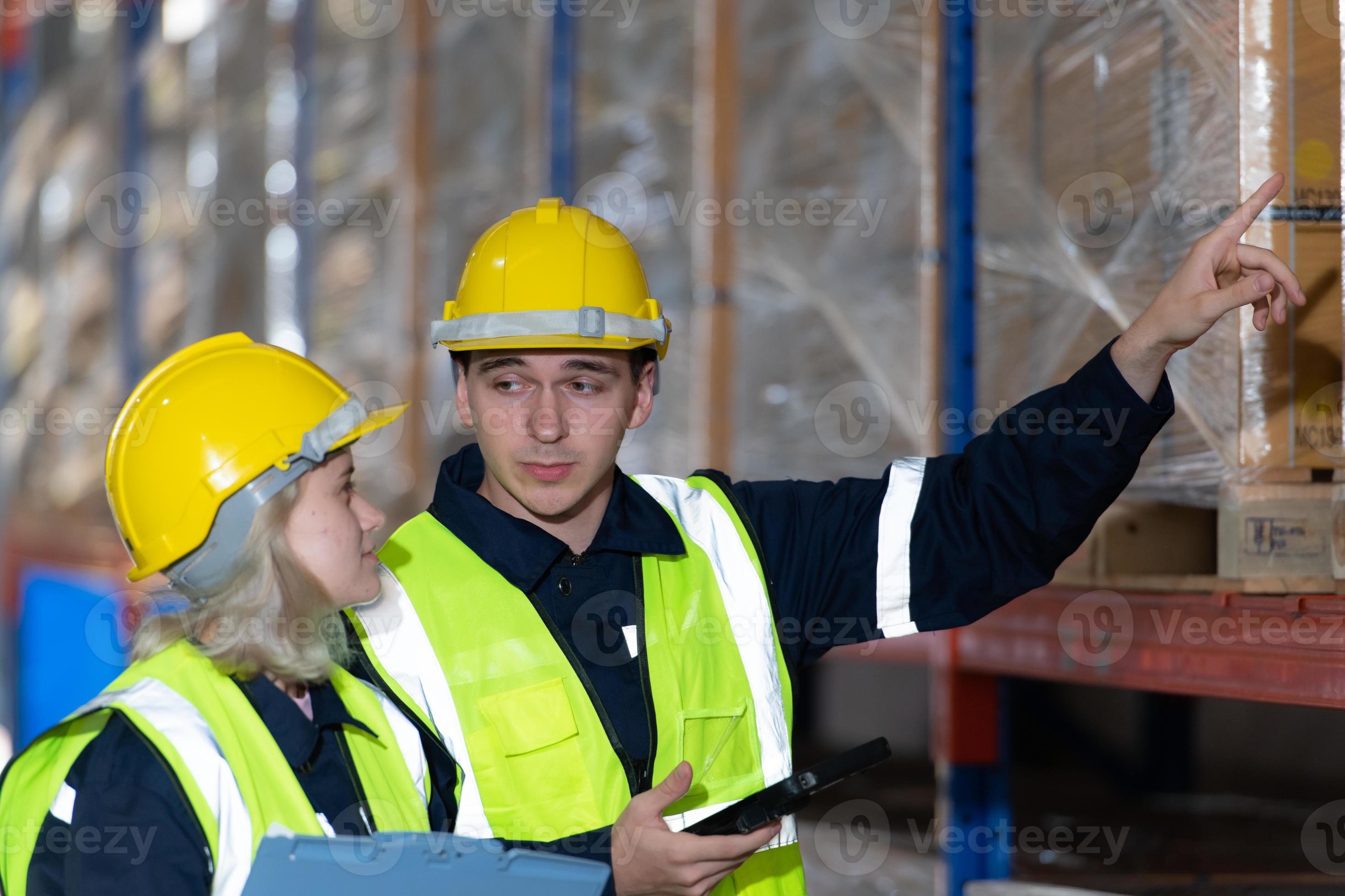Both of employees in an auto parts warehouse, Examine auto parts that