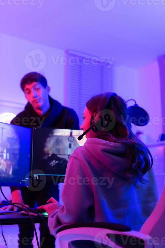 The mood of people waiting to play games when there is only one computer. When the game is over, it's time to switch players. photo