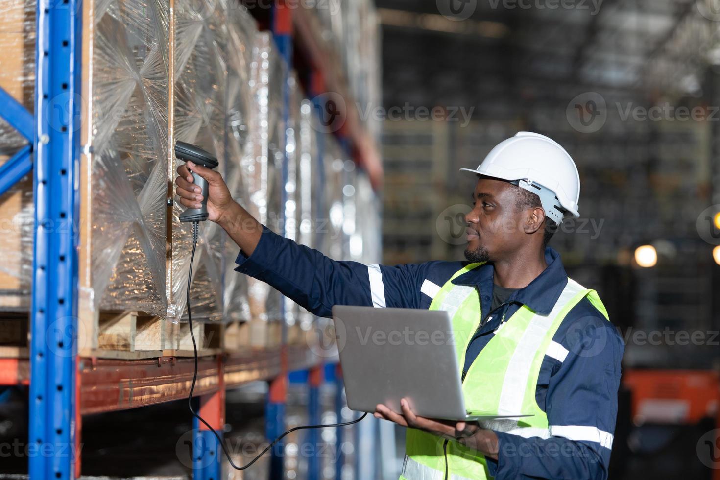 Head of worker in an auto parts warehouse, Examine auto parts that are ready to be shipped to the automobile assembly factory. photo