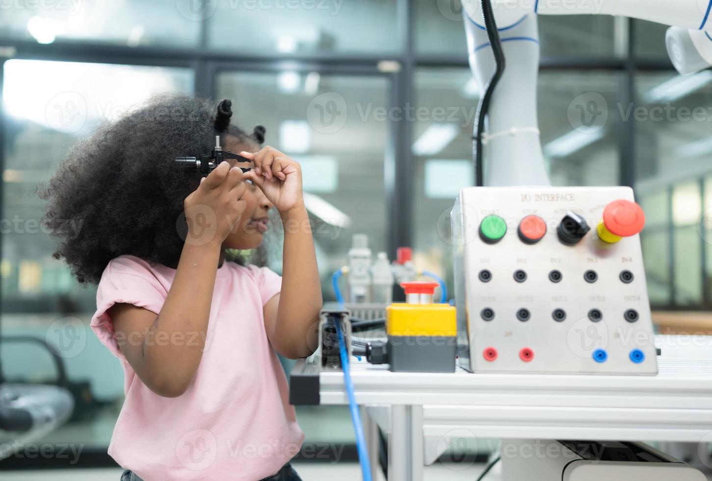 Youngsters utilizing the hand robot technology are having fun learning the electronic circuit board of hand robot technology, which is one of the STEM courses. photo