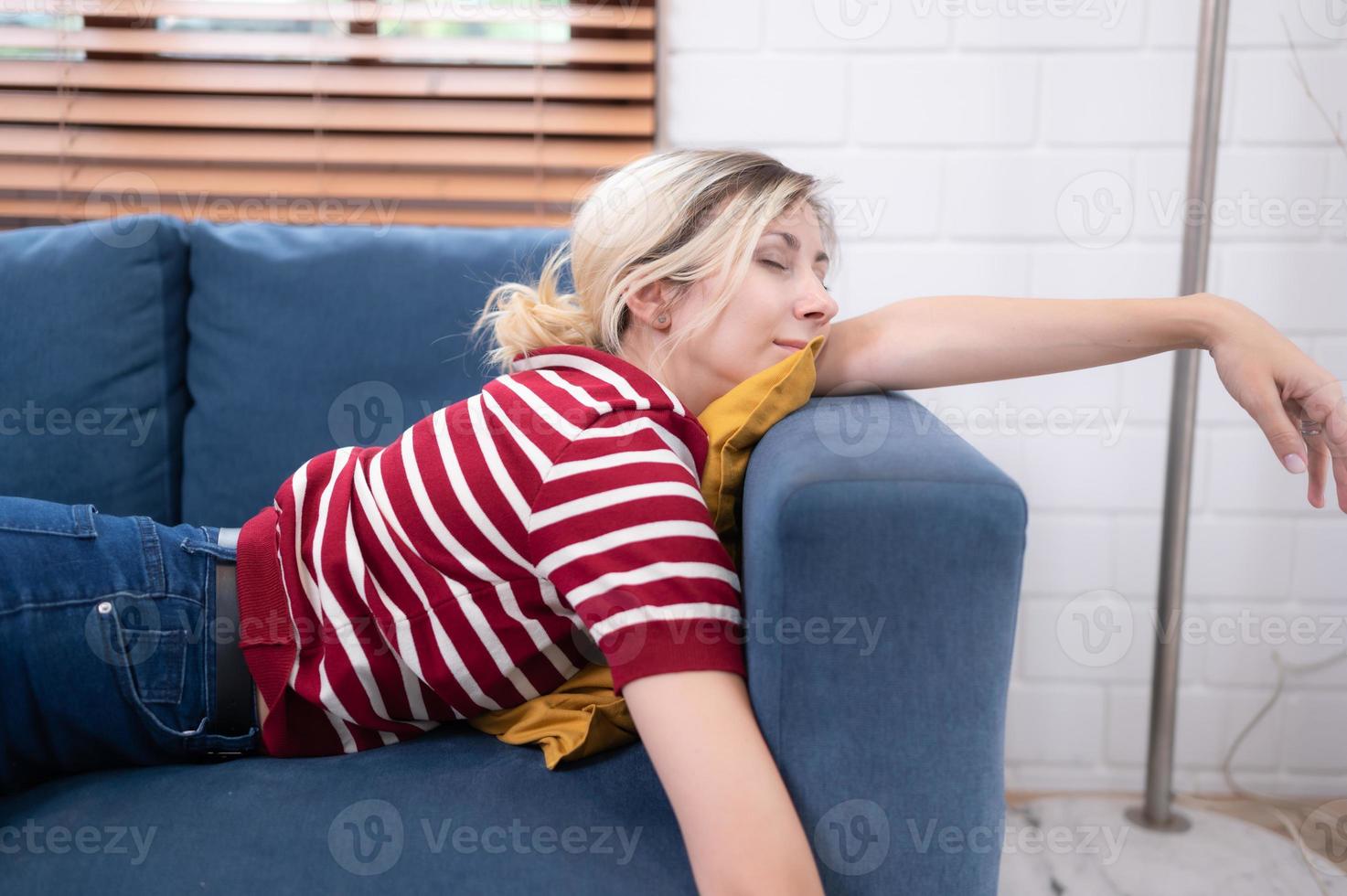 lazy girl lie still on the sofa of the house. photo