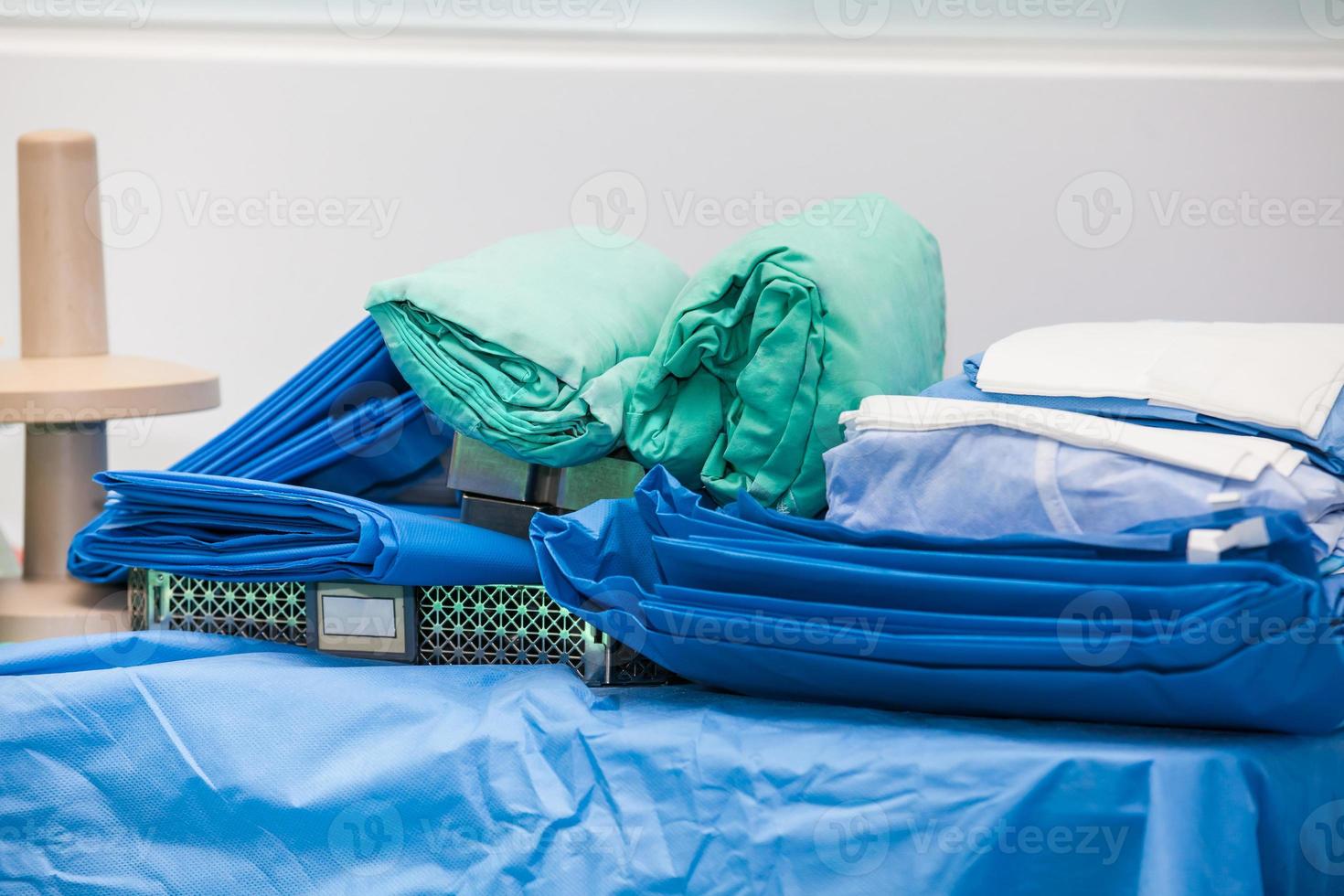 Sterile material and clothing ready for a surgical procedure at an operation room photo
