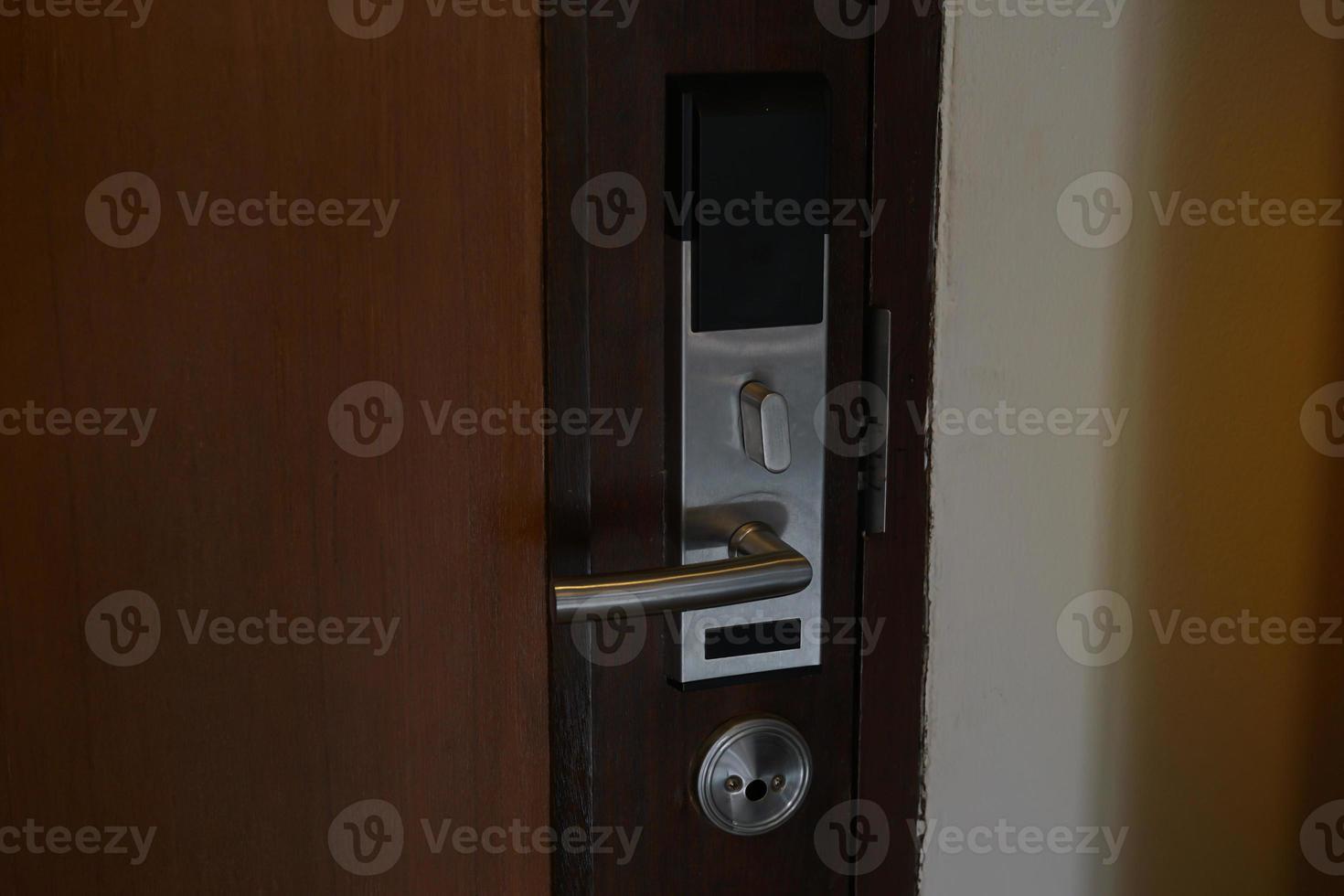 Inside the door that is equipped with a key card lock for hotels or general residences. It is an electronic door lock system that uses a card to open and close the door. Soft and selective focus. photo