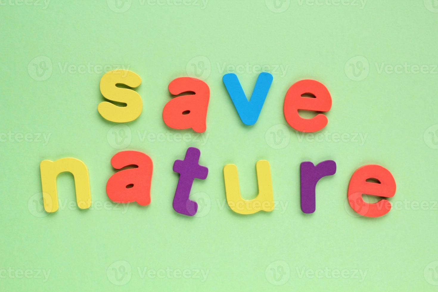 Colored letters Save Nature on green background. World Earth Day concept. Ecology green planet card. Environmental conversation and protection. Social banner, poster photo