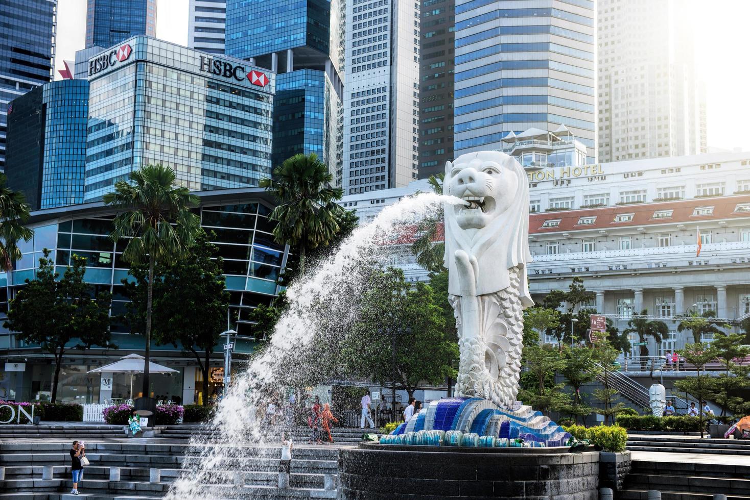 SINGAPORE-OCT 28-The Merlion fountain and Marina Bay Sand on OCT, 28, 2014. Merlion is an imaginary creature with a head of a lion and the body of a fish and  symbol of Singapore. photo
