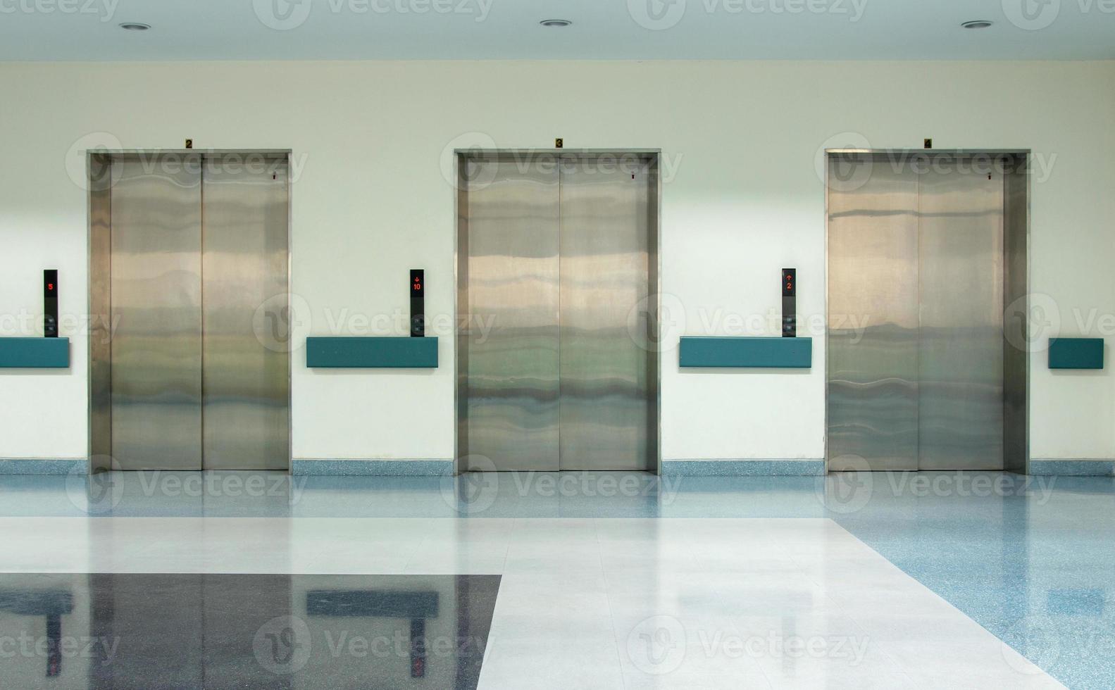Front View of Three Doors in Elevator with Closed Doors photo