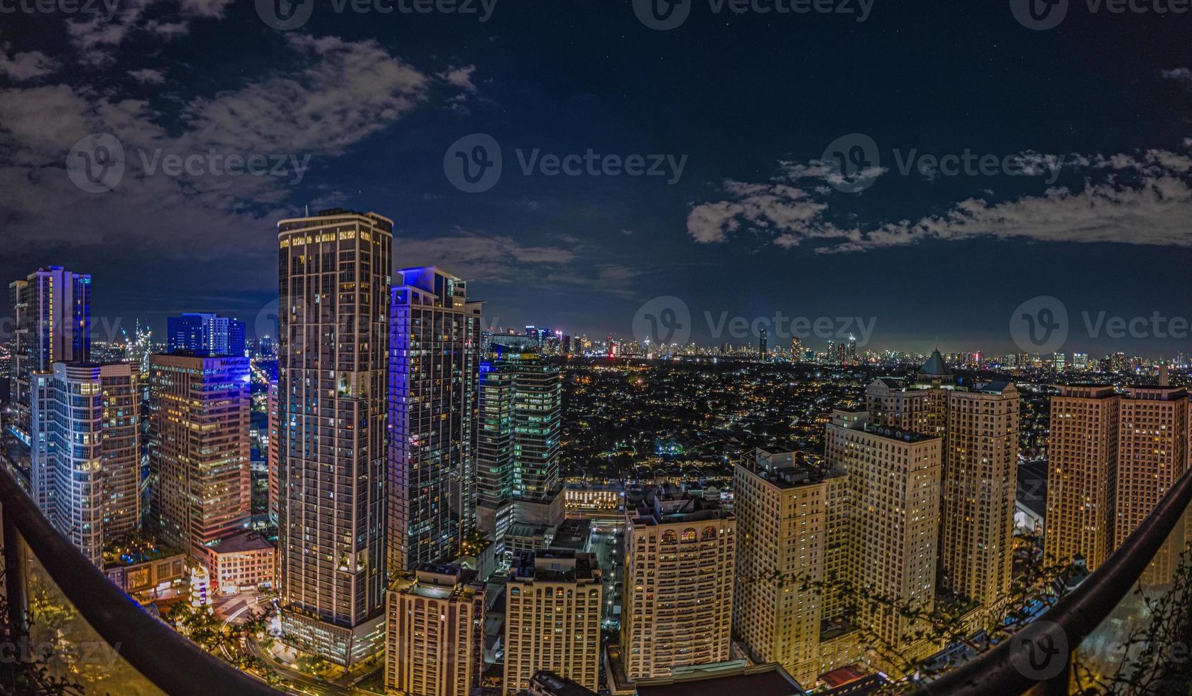 Panoramic image over Manila skyline at night photo