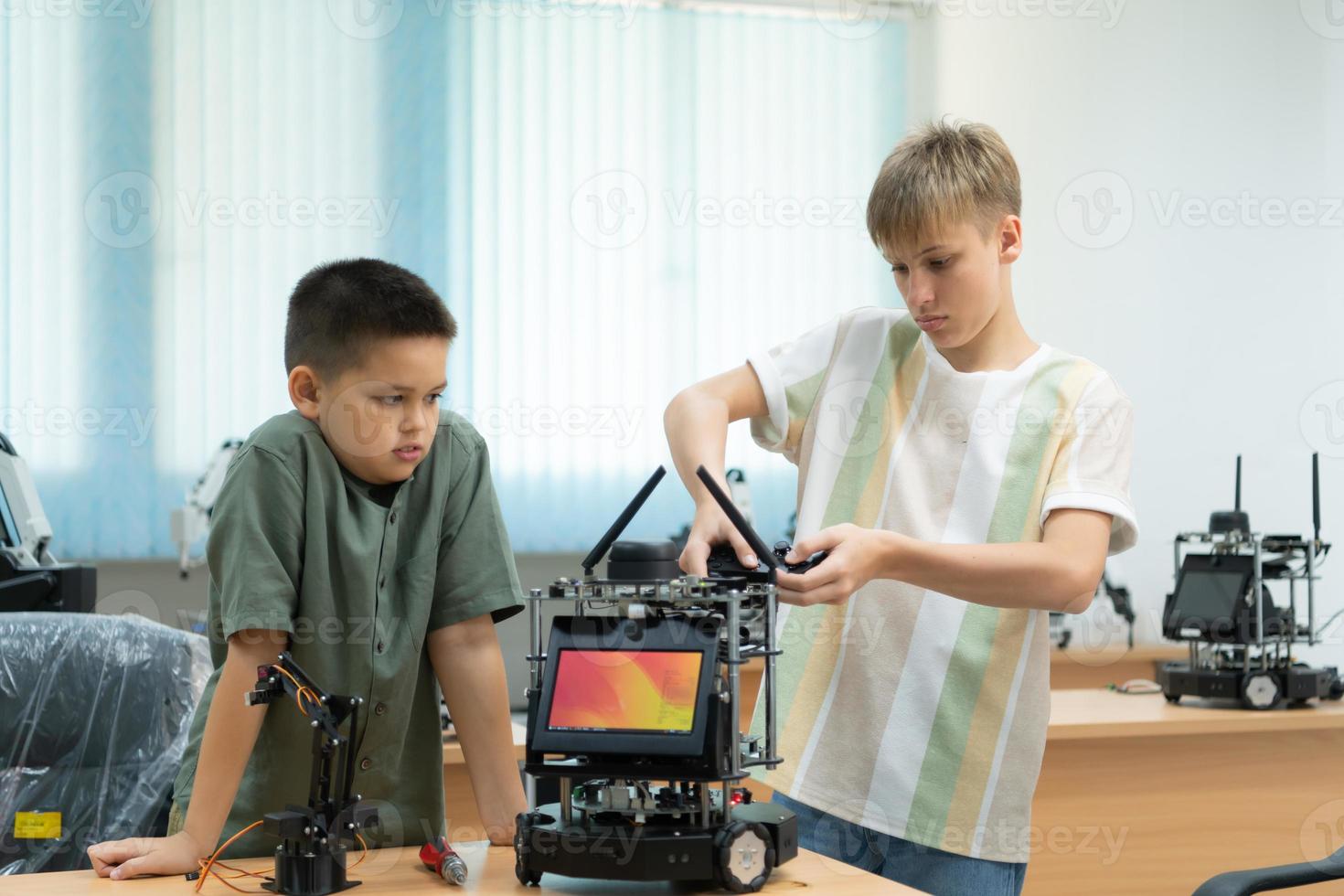 Children using the hand robot technology, Students are studying technology, which is one of the STEM courses. photo