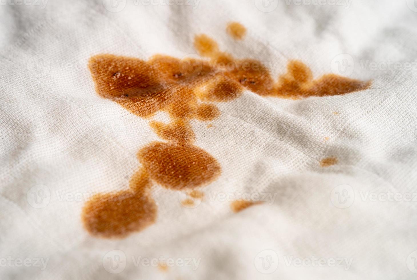 Dirty sauce stain on cloth to wash with washing powder, cleaning housework concept. photo