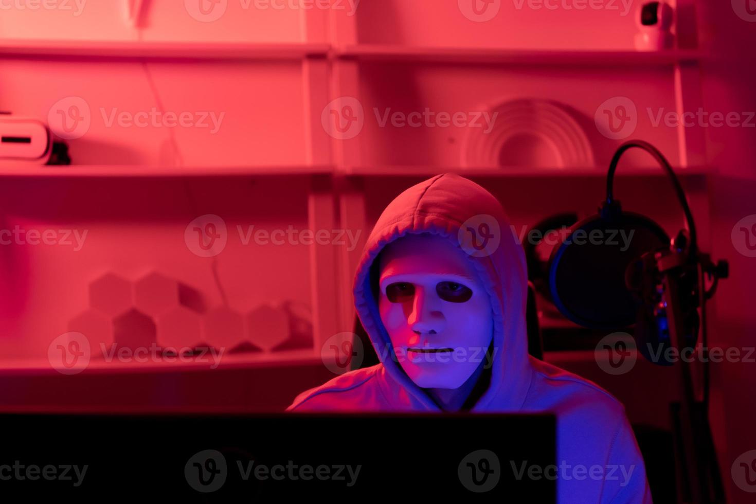 This is the face of a hacker who is knowledgeable with operating systems and other programs. He will exploit flaws and breach the computer system to cause damage. photo