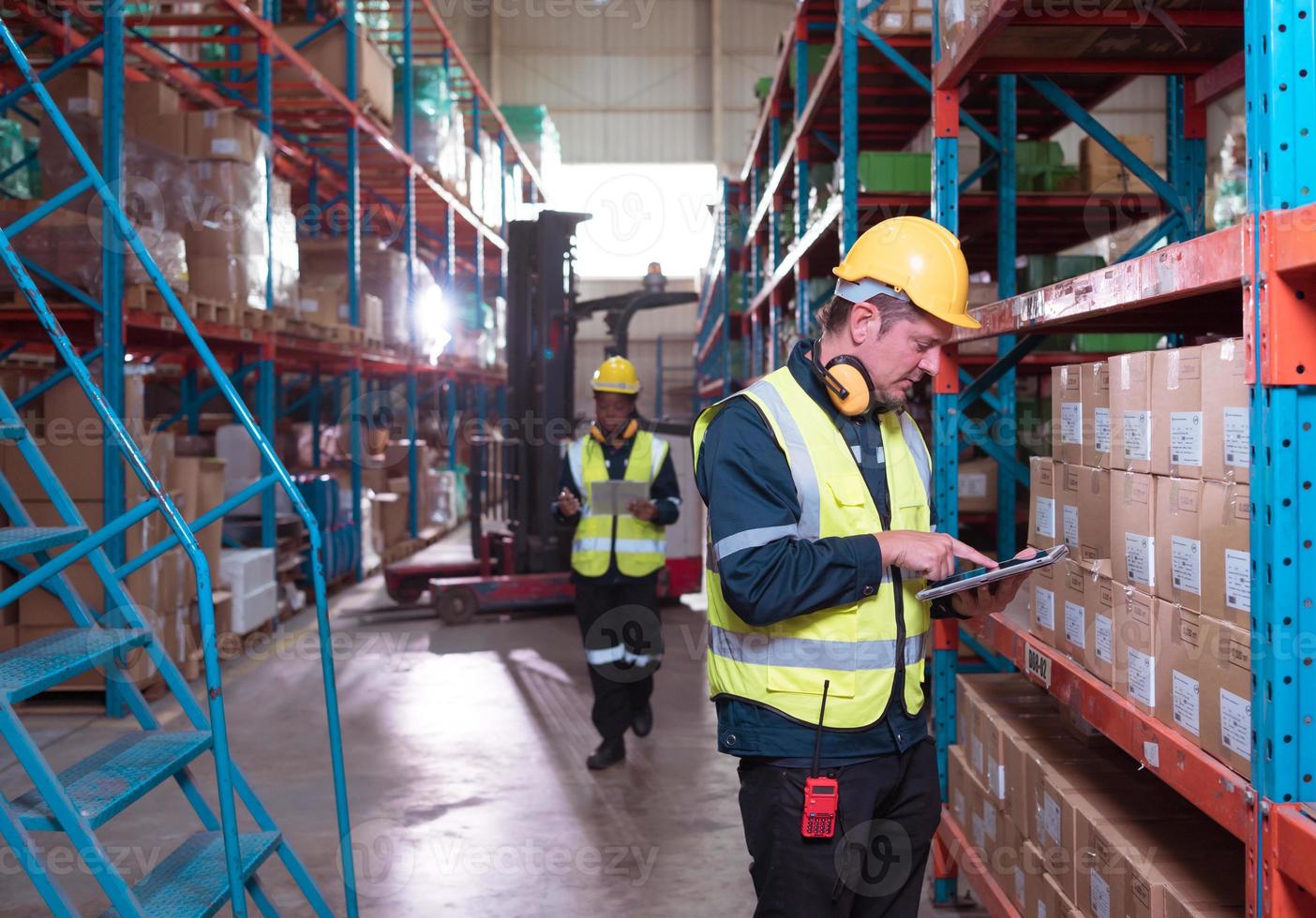 Warehouse foreman and employees Check the imported products in the central warehouse. before delivering to each region's distribution centers photo