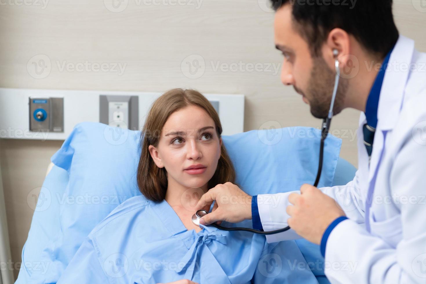 The doctor did a daily check-up and talked about the serious illness that had happened to the girl. to know the progress of treatment photo