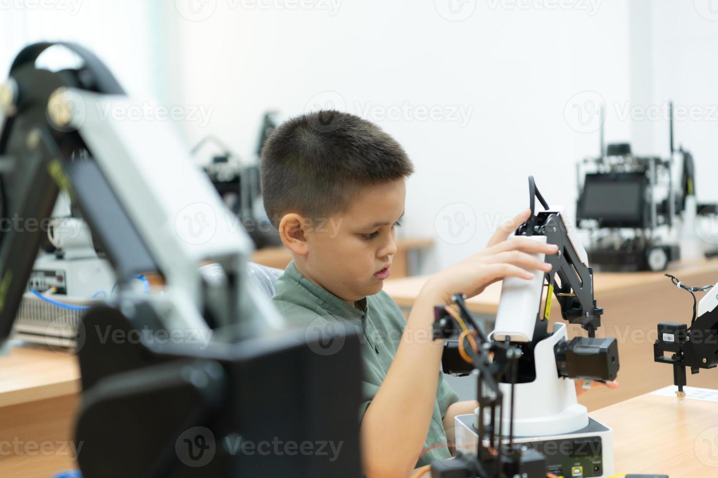 Children using the hand robot technology, Students are studying technology, which is one of the STEM courses. photo