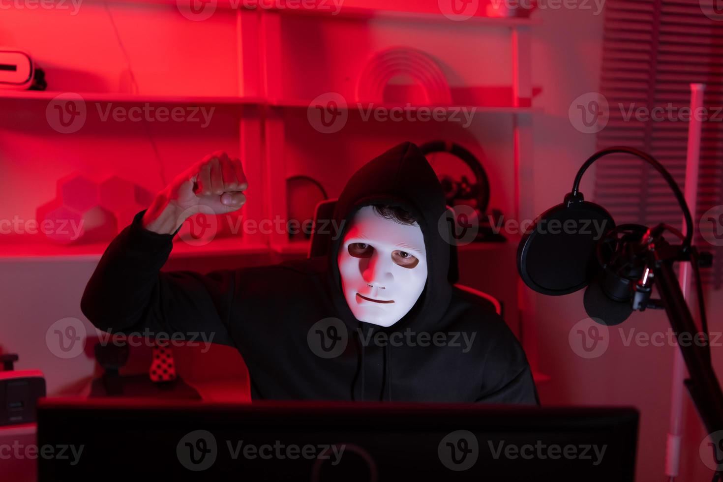 This is the face of a hacker who is knowledgeable with operating systems and other programs. He will exploit flaws and breach the computer system to cause damage. photo