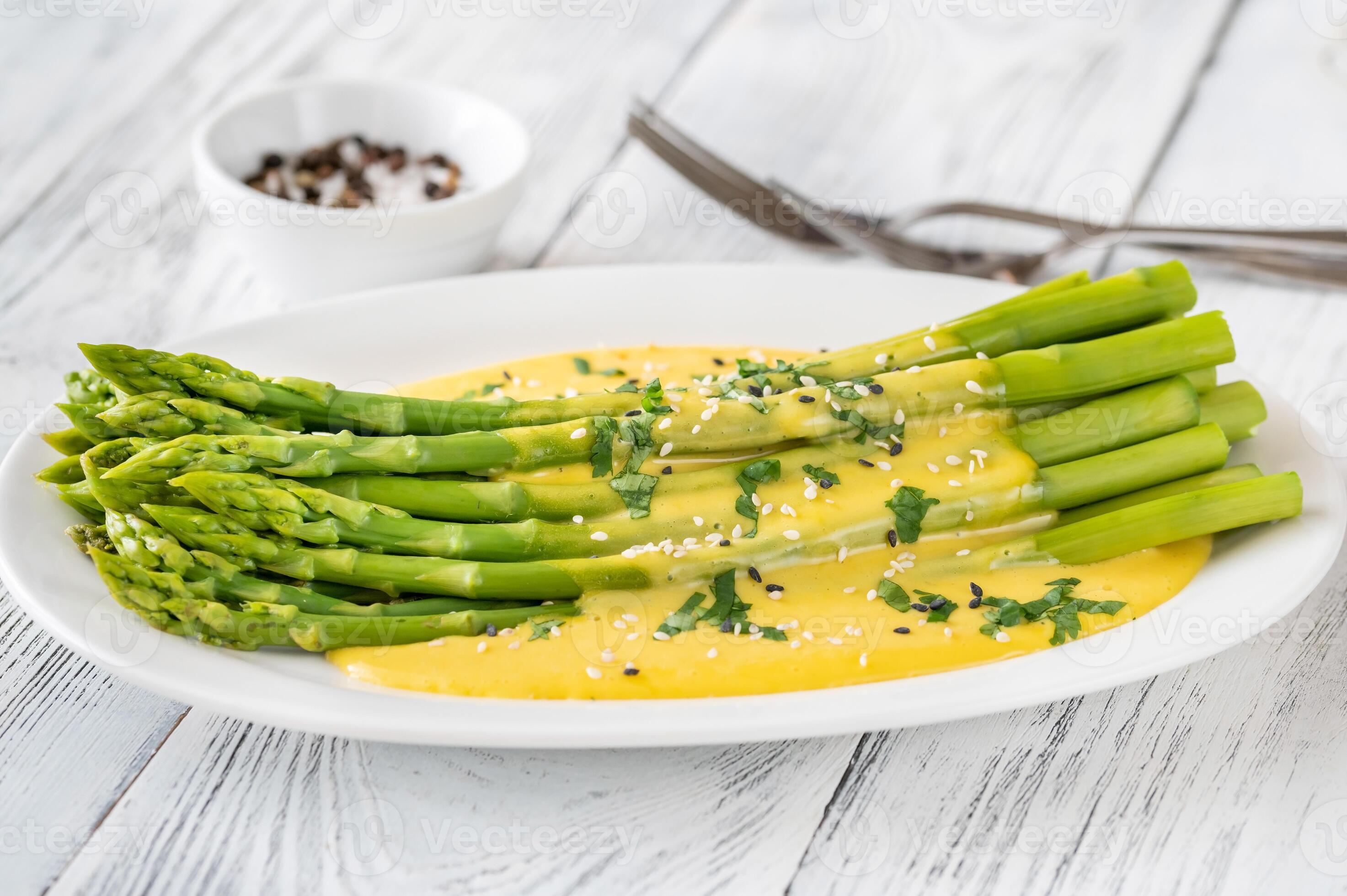 Cooked asparagus with Hollandaise sauce 22961435 Stock Photo at Vecteezy