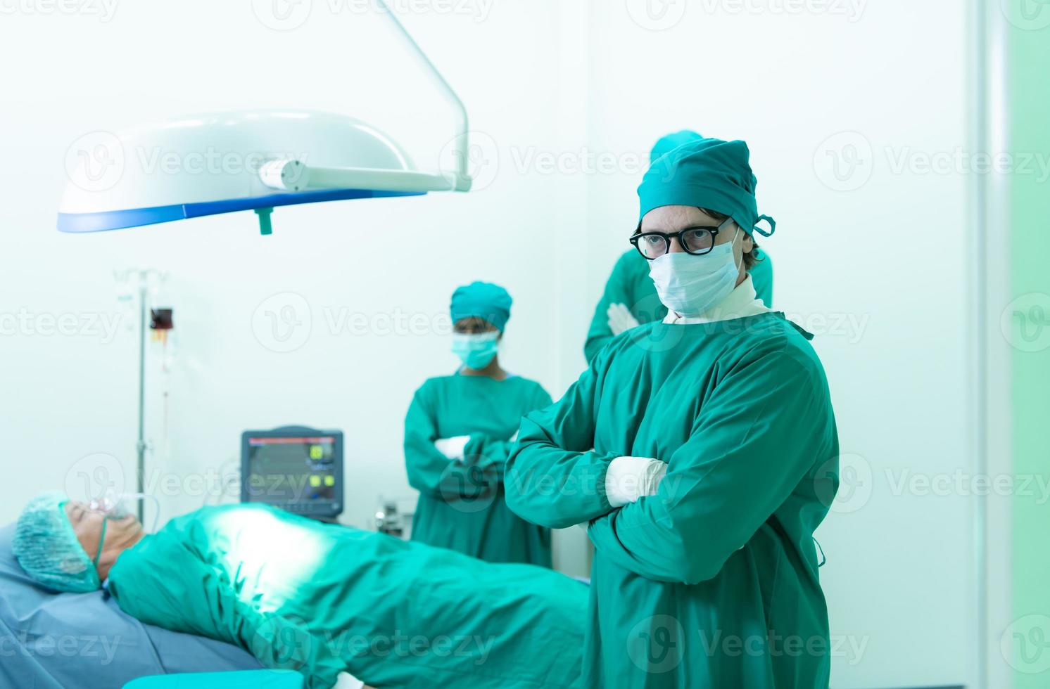 Portrait of professor of medicine in cardiology and a team of doctors in the operating room undergoing heart transplant surgery photo