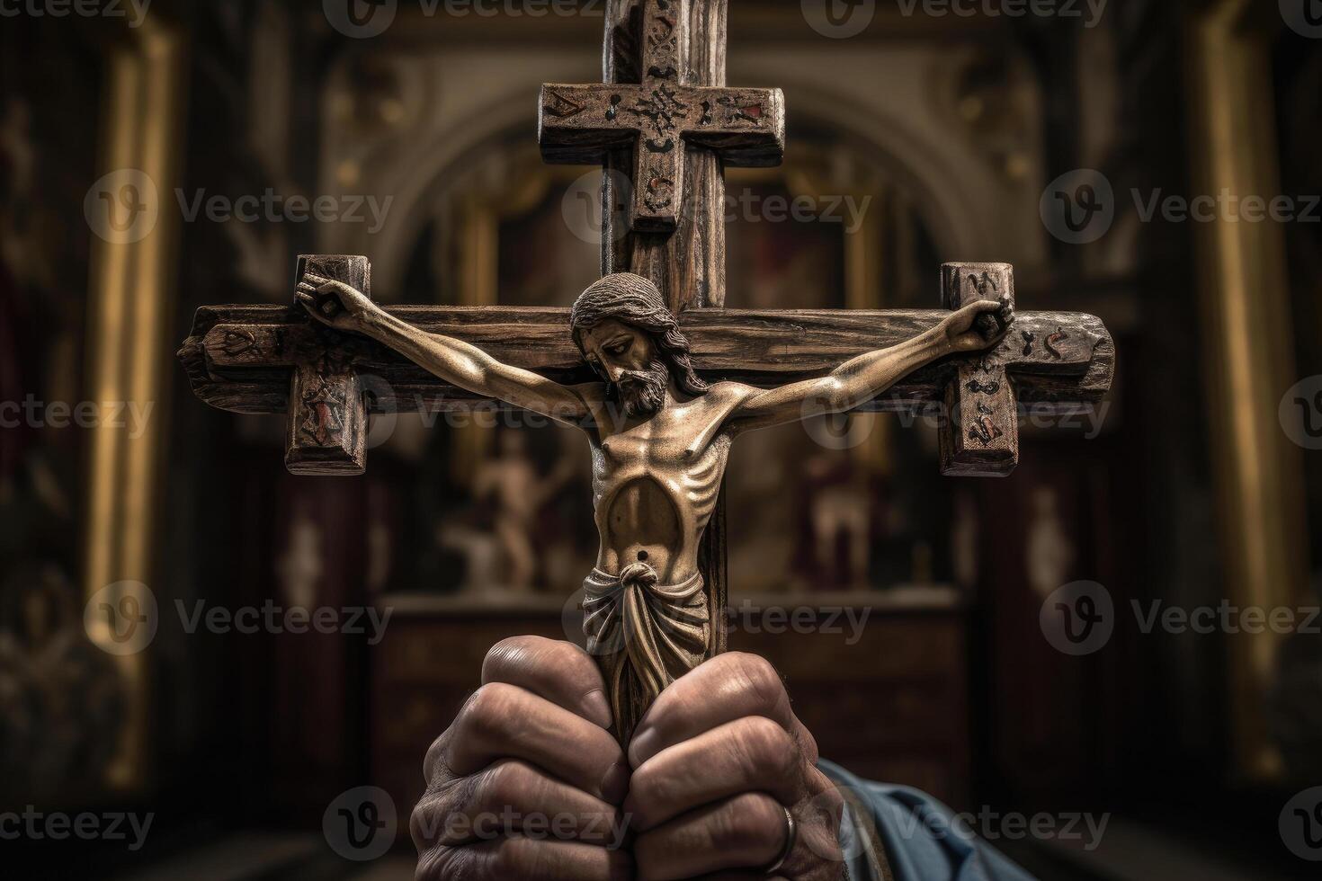 Church priest holds religious cross in hands. photo