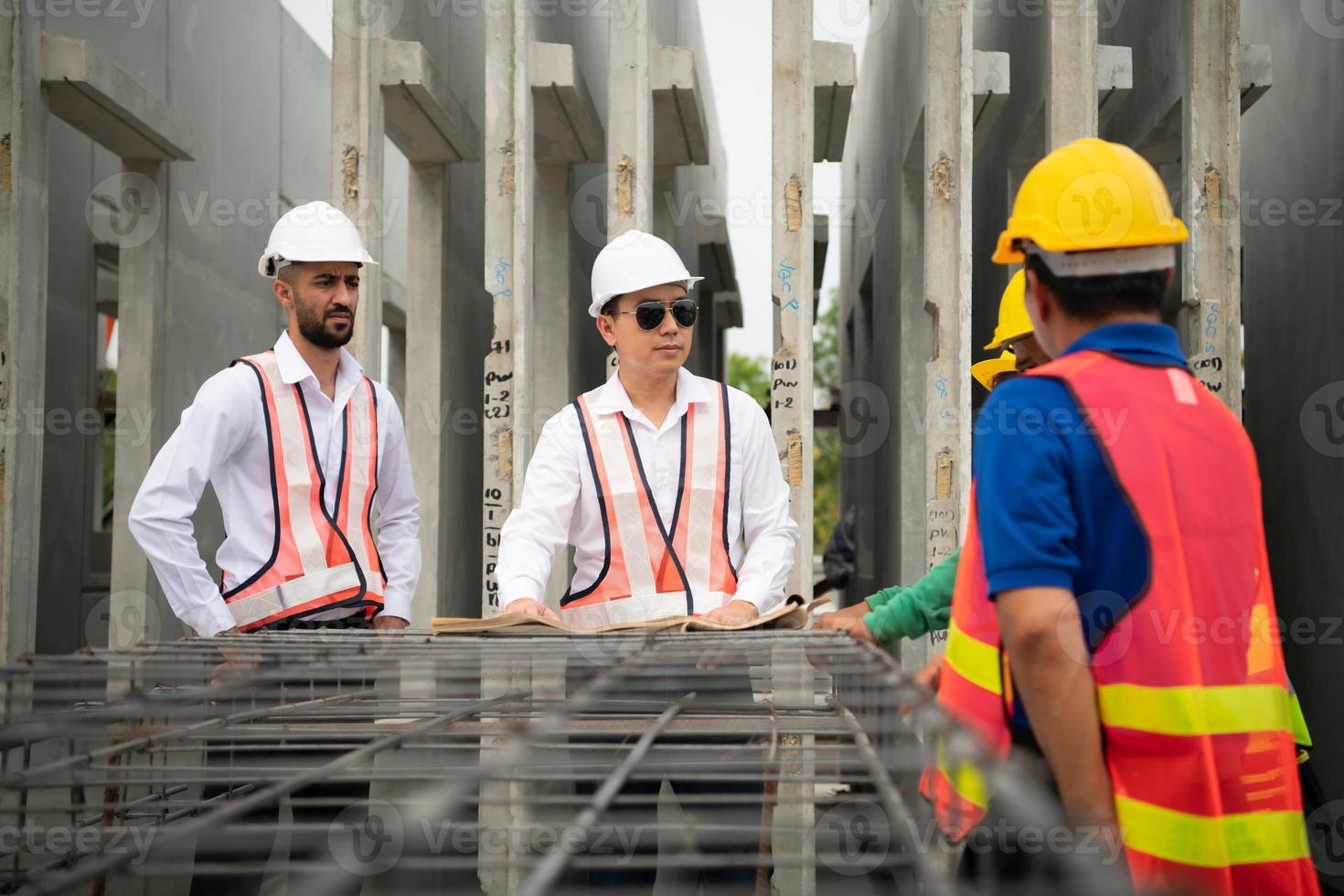 Construction engineer and construction foreman Monitor the progress and supervise important construction works on the construction site. photo