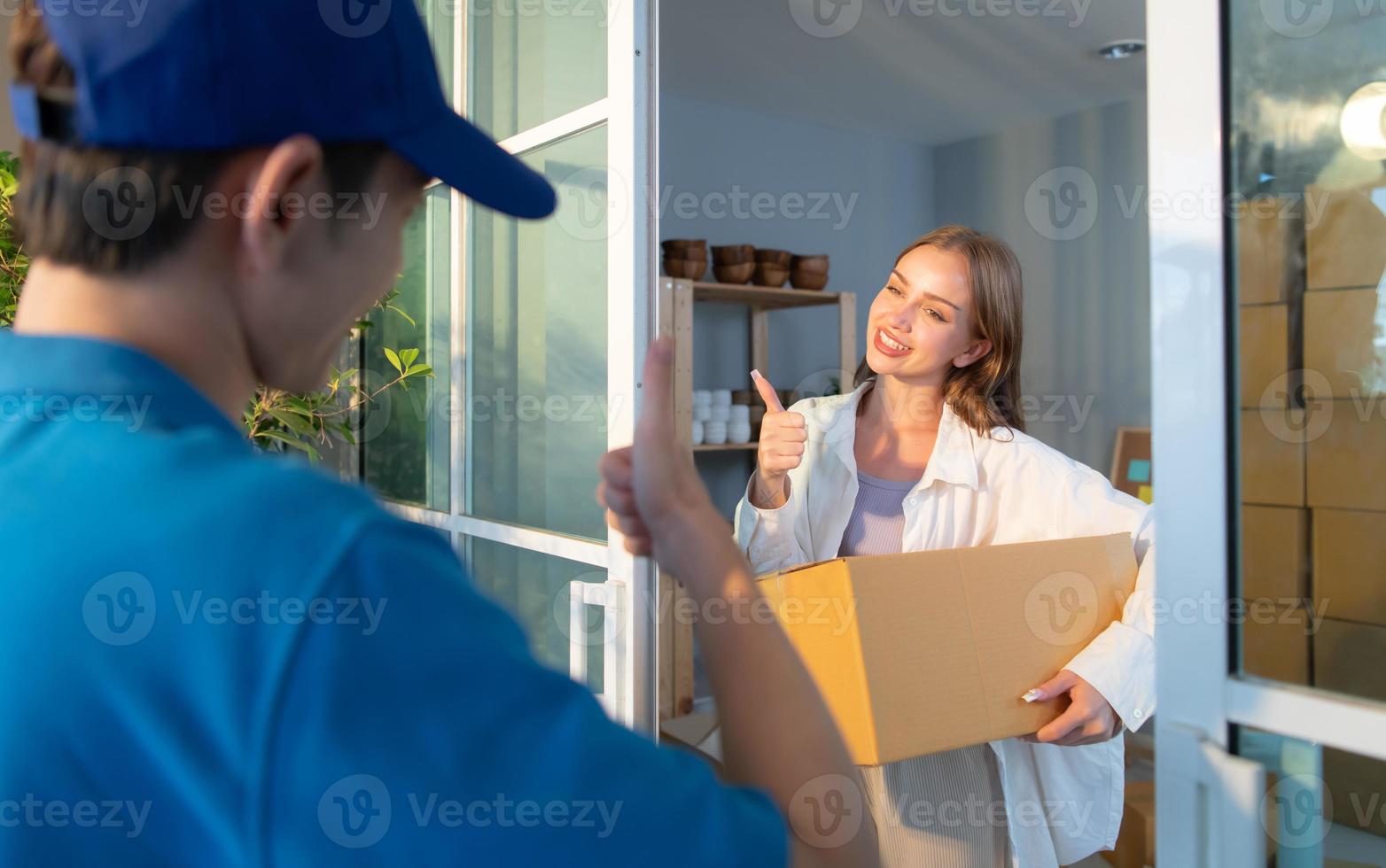 The delivery man brings the goods that the customer purchased and delivers them to the customer's home. photo