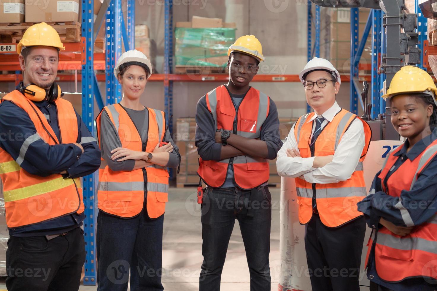 Portrait of Group employees in a warehouse, Consisting of Warehouse supervisors Distribution Manager and Warehouse Specialist photo