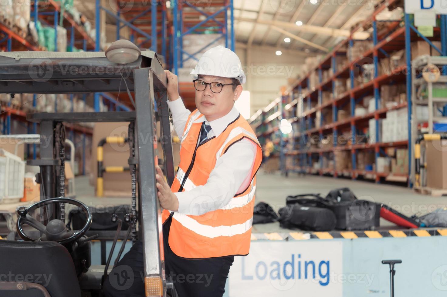 Warehouse manager Examine the equipment used to move goods in the warehouse and test drive a forklift. photo