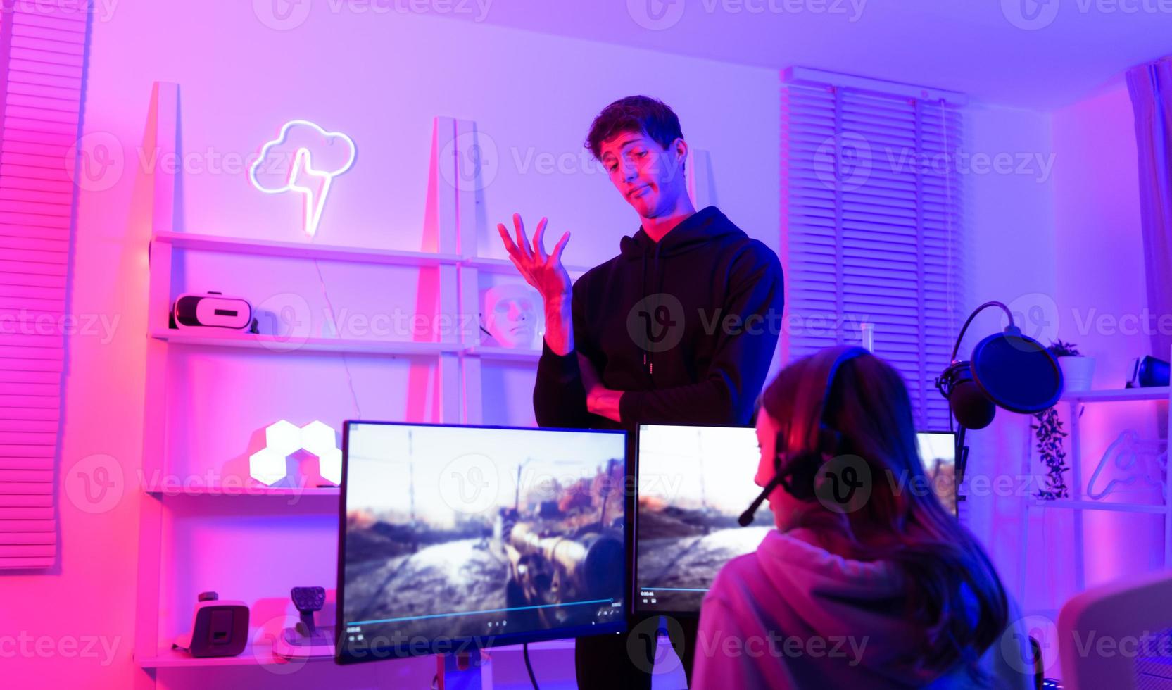 The mood of people waiting to play games when there is only one computer. When the game is over, it's time to switch players. photo
