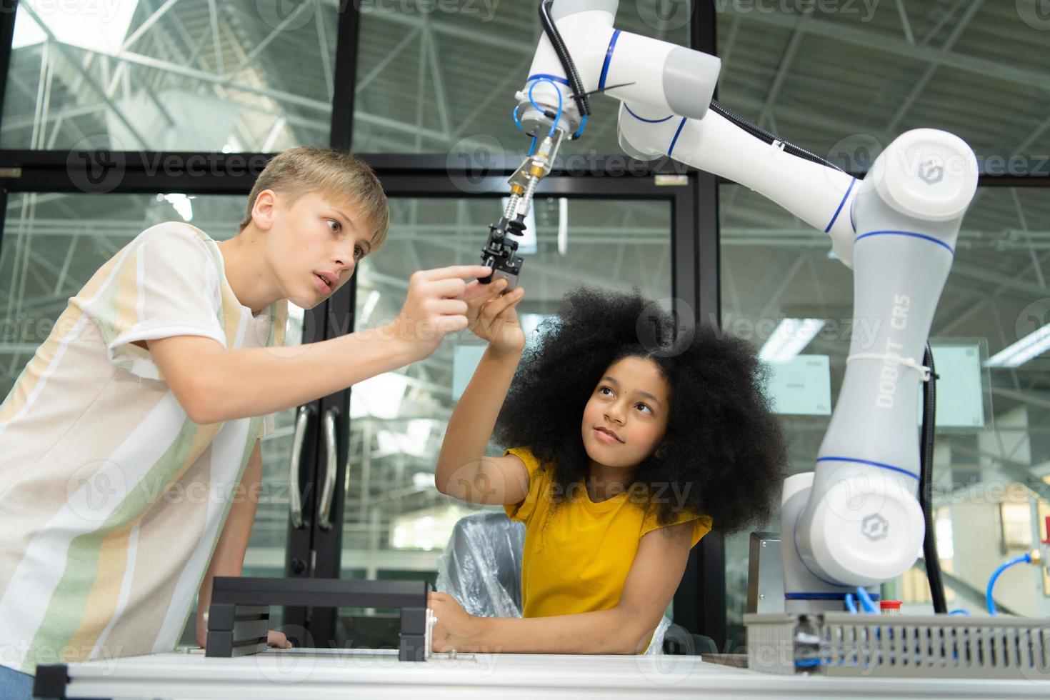 Children using the hand robot technology, Students are studying technology, which is one of the STEM courses. photo