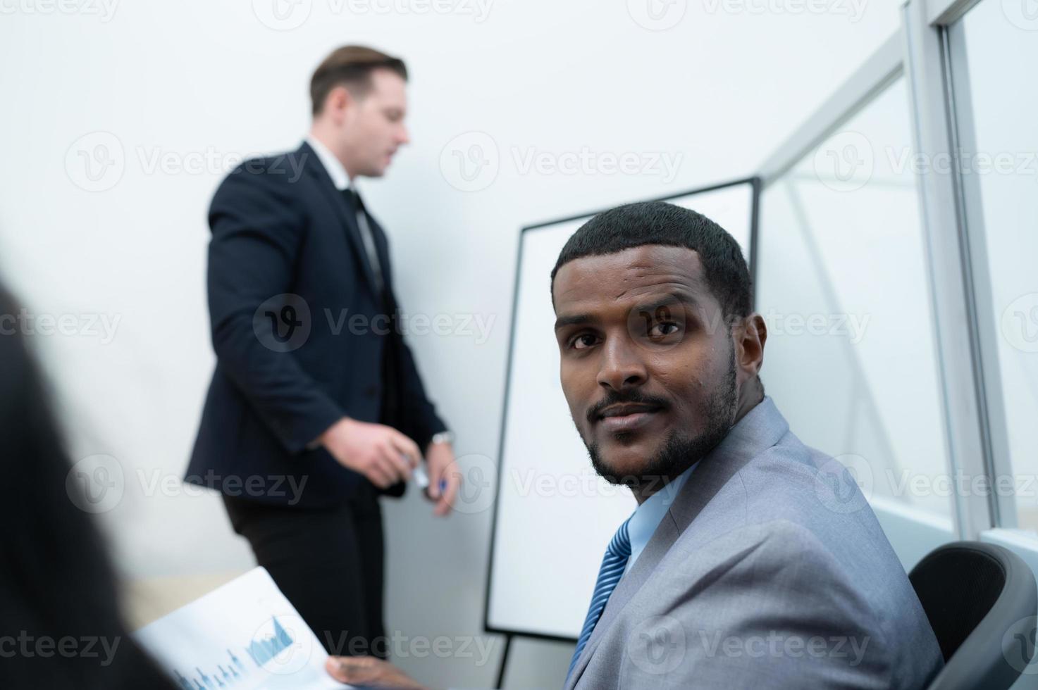 Businessmen with a meeting of the new management team with information comment finding common conclusions photo