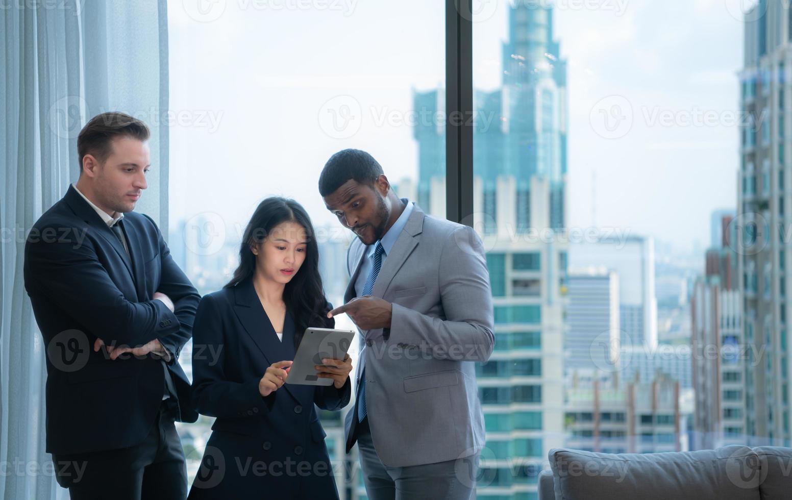When a group of new businessmen get good news about projects that customers consider accepting proposals. They were overjoyed and delighted with such good news as they sit and rested in the office photo