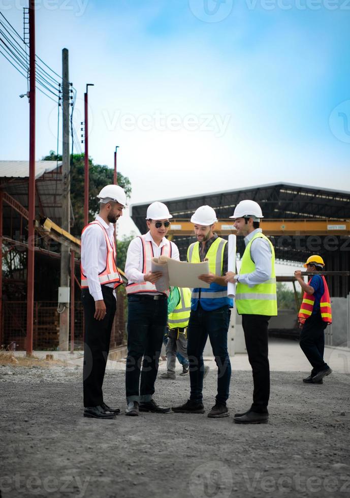 Architects a visit to the construction site. Ready to talk the progress of construction projects in the construction area with construction supervision engineers. photo