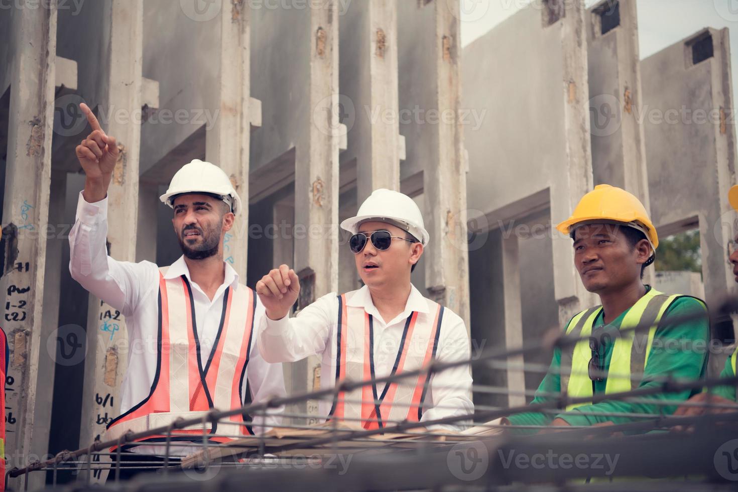 Construction engineer and construction foreman Monitor the progress and supervise important construction works on the construction site. photo